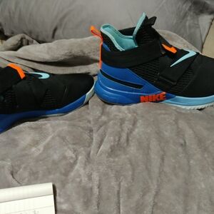 Nike Kids Black and Blue Sneakers with Orange Accents